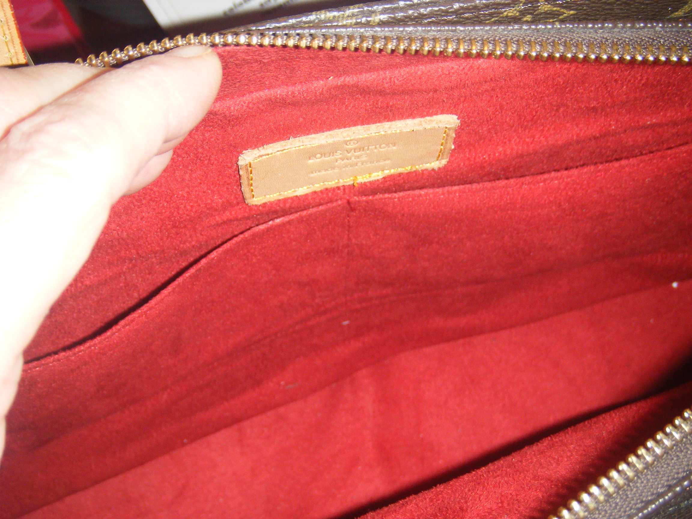 Louis Vuitton Handbag with red interior | myclosettoyours